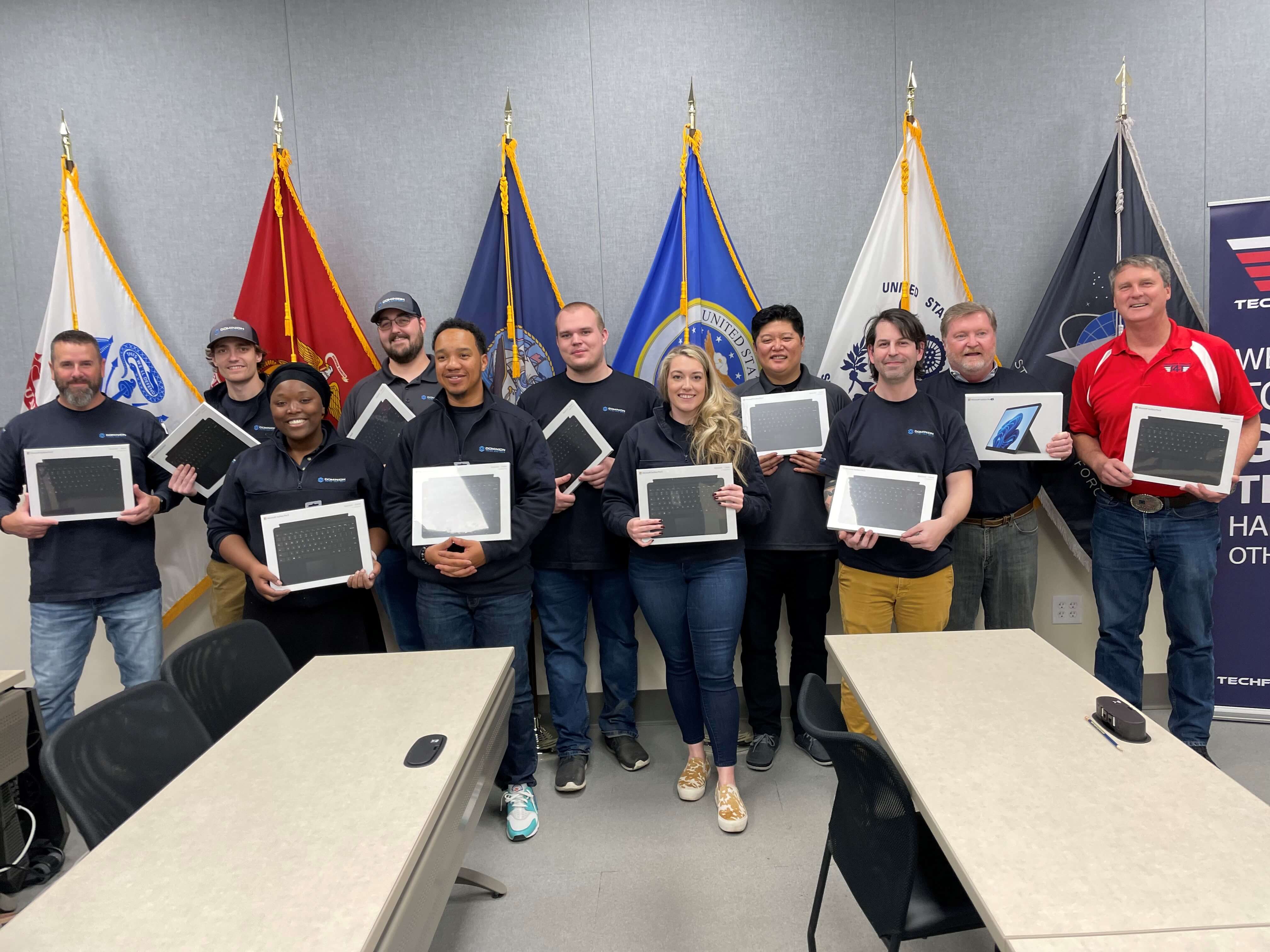 Donation of 16 Microsoft Surface Pro X laptops and keyboards to Tech for Troops